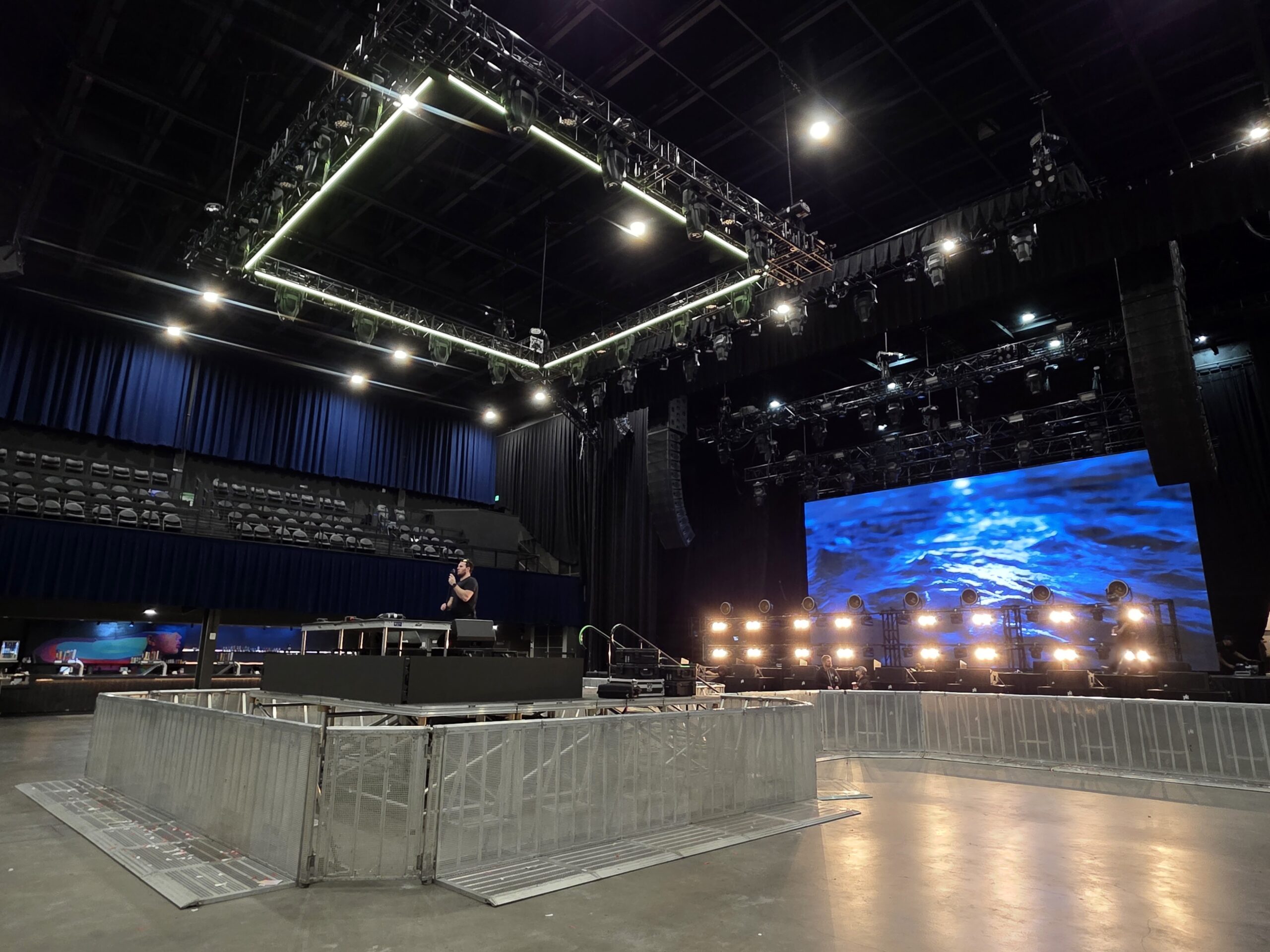 Large venue production setup with truss grid, LED wall, and PK Sound line arrays — Photo: AKA Event Productions and Nexus AV at Mission Ballroom